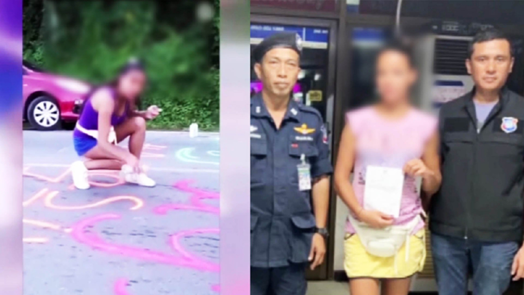 จับปรับแล้ว! สาวรัสเซียมือบอน ใช้สีสเปรย์พ่นข้อความบนผิวถนนภูเก็ต [คลิป]